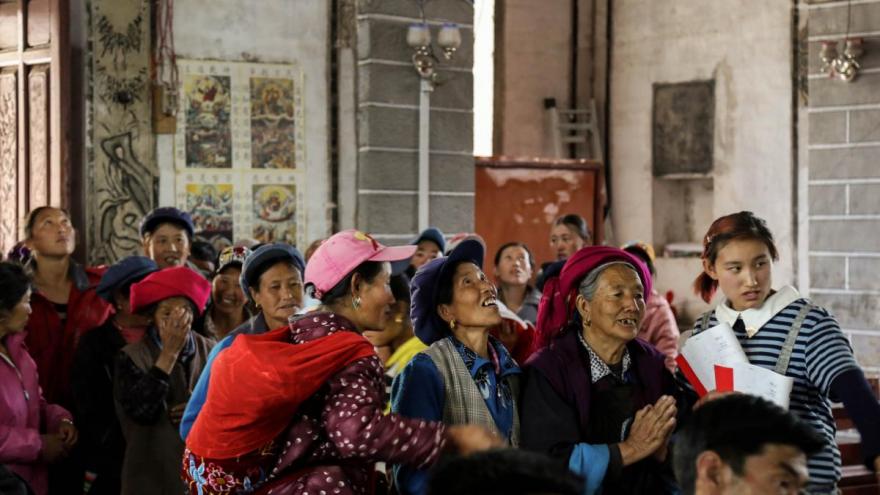 Congregants arrive at a Holy Thursday Mass at Cizhong Catholic Church, Yunnan. Photo by Liu Haiming.