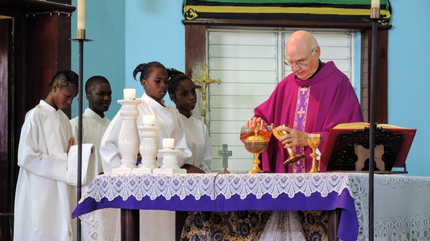 Mass with a visiting missionary priest at St. Anne's, West Kingston, Jamaica, 2013.