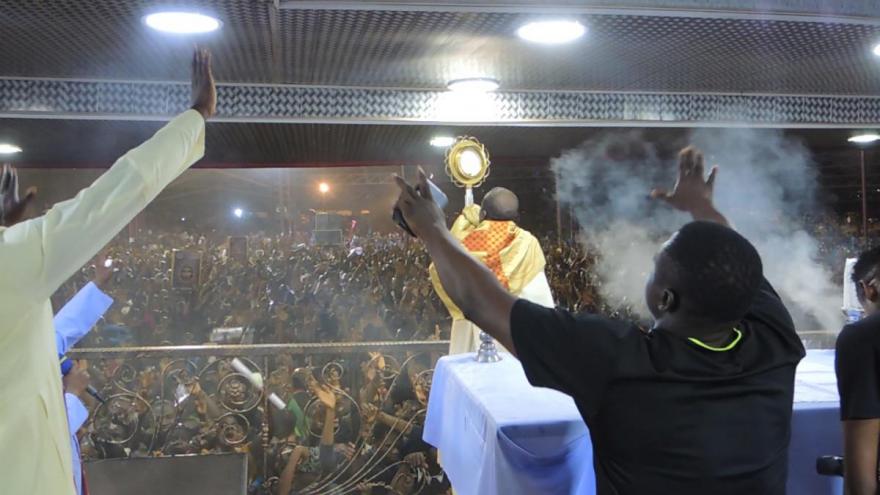 Eucharistic adoration at an all-night worship service outside Enugu, Nigeria.