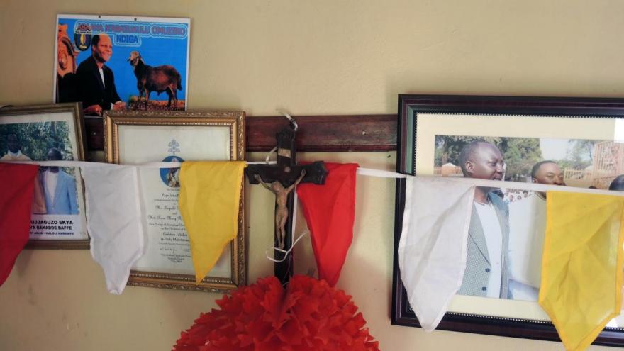 Religious and familial decorations in a family home near Jinja Karoli, Uganda. Religious and familial decorations in a family home near Jinja Karoli, Uganda.
