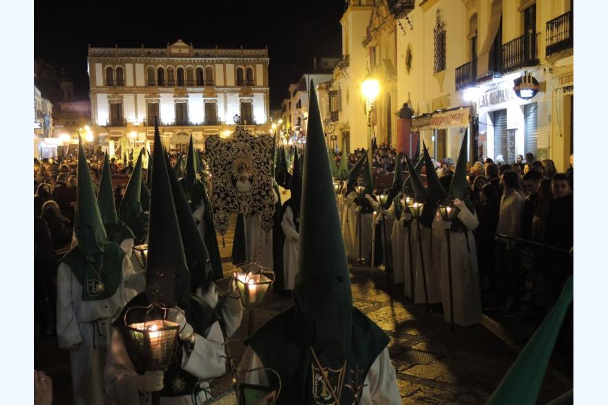 The Holy Wednesday procession of the brotherhood de Nuestro Padre Jesús en la Columna y María Santísima de la Esperanza — Our Father Jesus at the Column and Most Holy Mary of Hope — passes through the center of Ronda.
