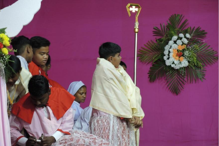 Bishop's crozier held by an acolyte during the Mass for Dhori Mata.