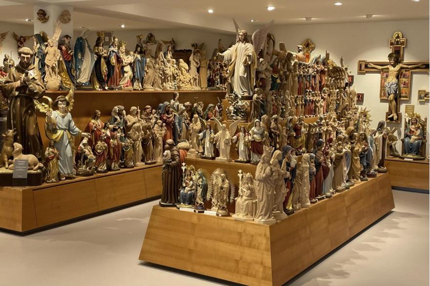 Two large platforms display hundreds of wood carvings of religious figures for sale in a shop in Oberammergau.