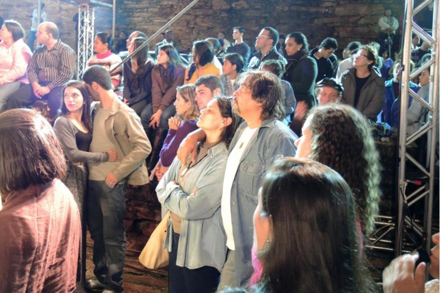 Spectators watch the washing of the feet on Holy Thursday in front of St. Francis of Assisi Church.