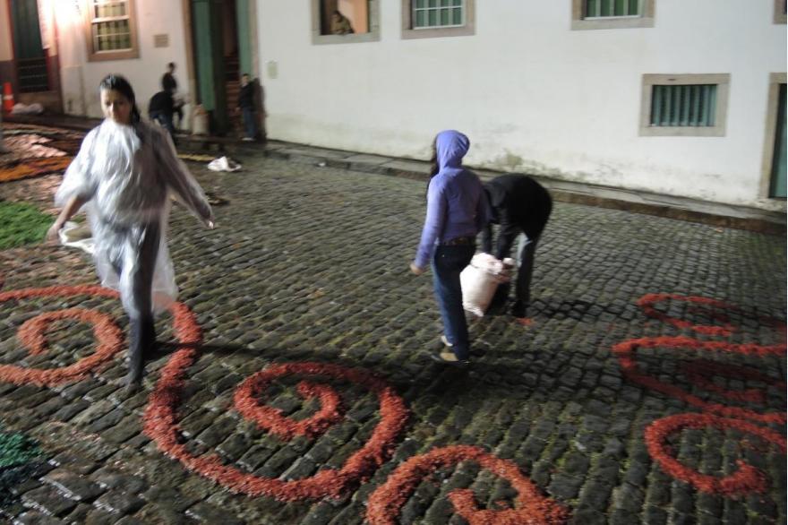Children are often up late to help in the work of laying out the tapetes for the Easter procession.