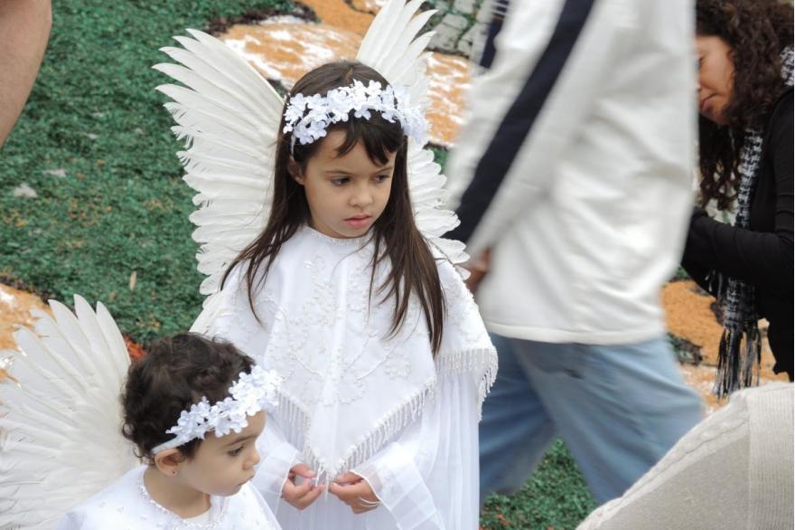 Angelic children await the start of the early morning Easter procession.