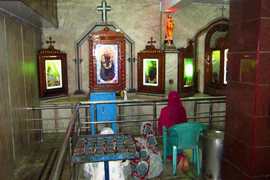 Women praying inside St. Anthony's shrine, one of the small, privately built Catholic shrines in Bengaluru.