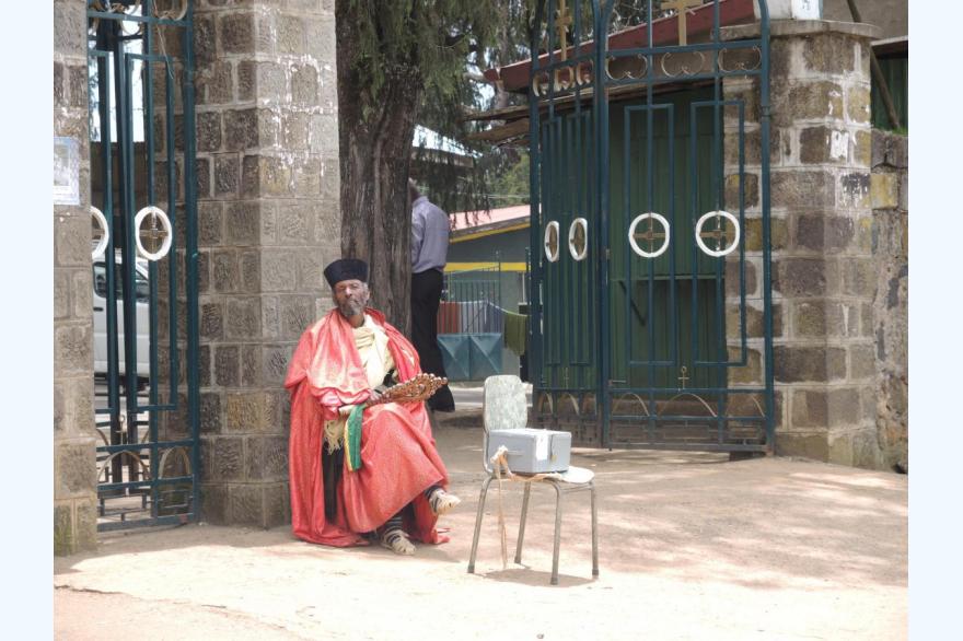 An Orthodox priest begs alms outside the Maryam church Entoto Hill, near Addis Ababa.