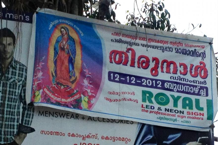 Catholic businesses often use religious images in advertising, even this image of Our Lady of Guadeloupe. Kerala, India.