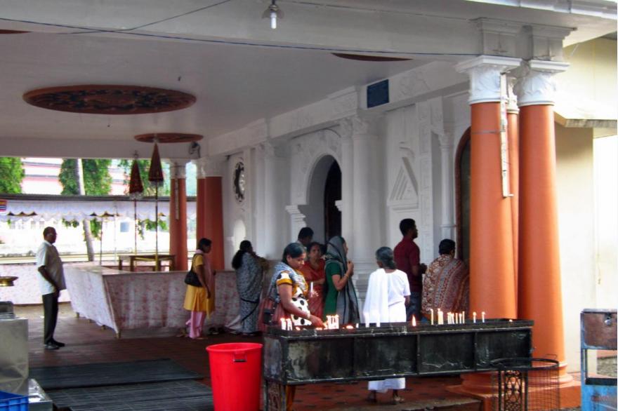 Worshipers line up to offer prayers at a Syro-Malabar church.