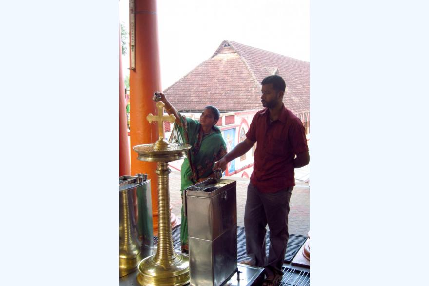 Pouring oil over a cross is a popular form of devotion in Syro-Malabar churches.
