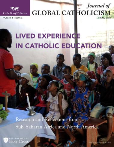 Cover image of Journal of Global Catholicism features a photo of children in a catechism class in Nigeria sitting on benches looking at a teacher standing in front of a low altar with a cross and candle.