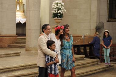 A young woman poses with her family after her quinceañera Mass. Our Lady of the Valley Church, Yerba Buena, Argentina.