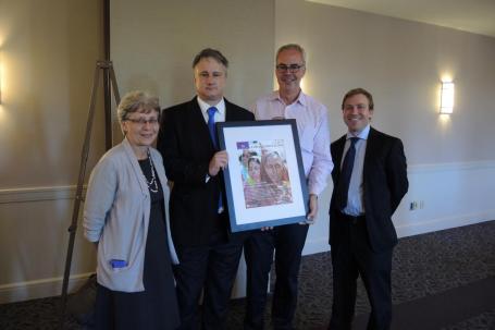 Vice President of Academic Affairs and Dean of the College Margaret Freije joins Mathew N. Schmalz, Thomas M. Landy and Marc R. Loustau at a reception to celebrate the launch of the Journal of Global Catholicism.
