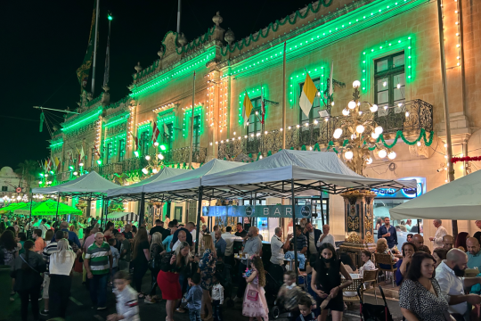 Families enjoying themselves in front of the San Filippo Band Club headquarters  on the eve of the feast of San Filippo d'Agira, Żebbuġ.