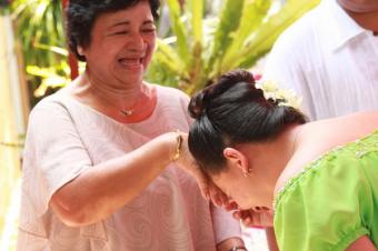 Mano is a traditional Filipino greeting where a young person bows his or her forehead to the elder and raise the elder’s right hand to touch the back of the hand to the forehead.