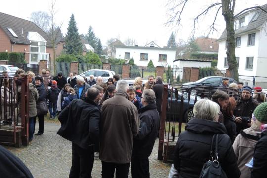 Worshipers gather after Mass at St. Martin's Kirche, at the Eastern edge of Berlin.